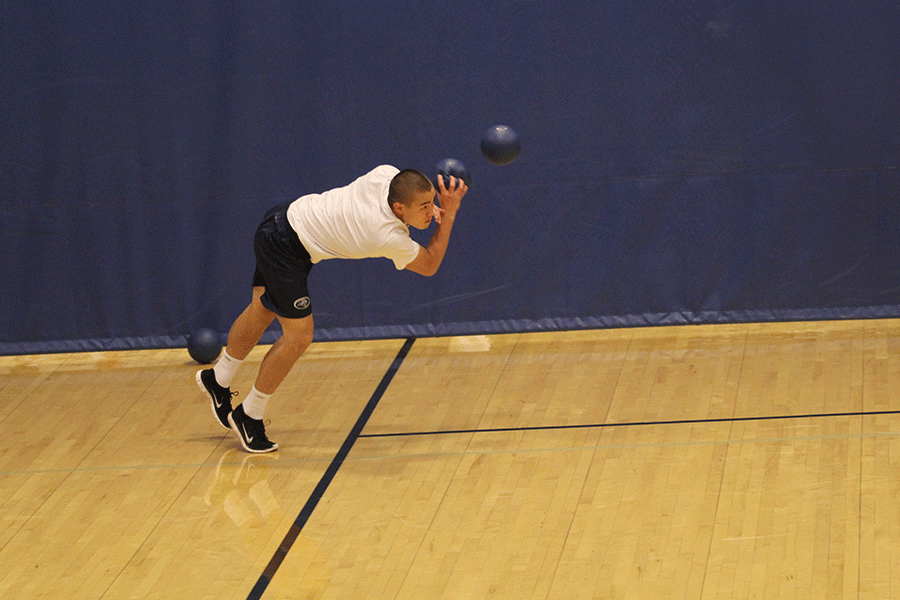 Junior Chase Midyett dodges a ball to try and stay in the match.
