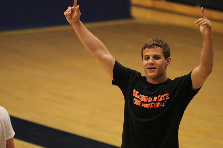 Junior Seth Burnett celebrates after winning a match.