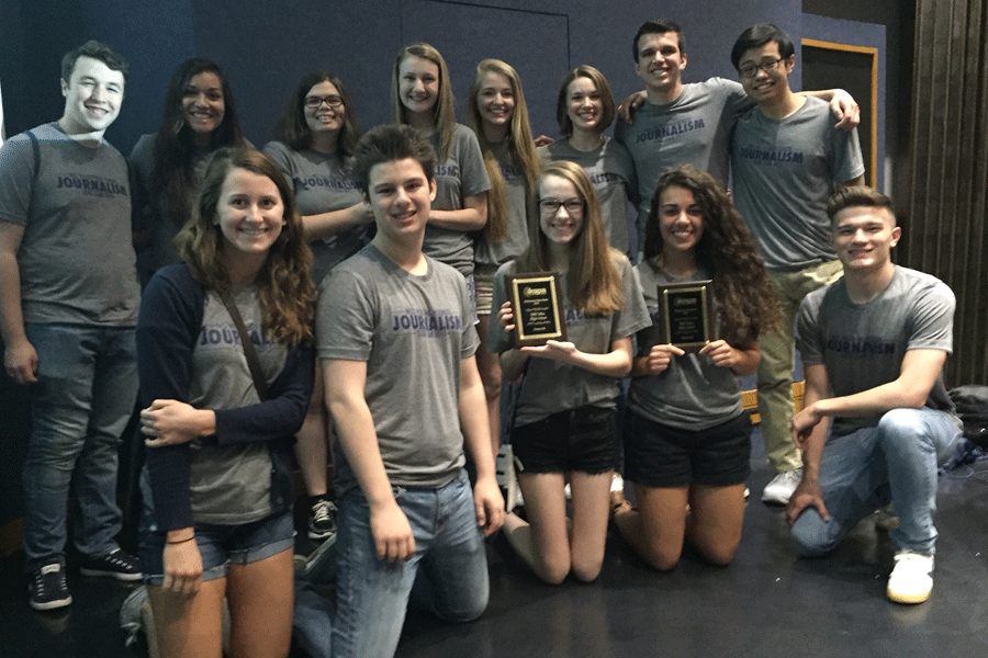 A portion of the state journalism team accepts the schools All-Kansas plaques for the JAG yearbook, JagWire newspaper and MVTV.