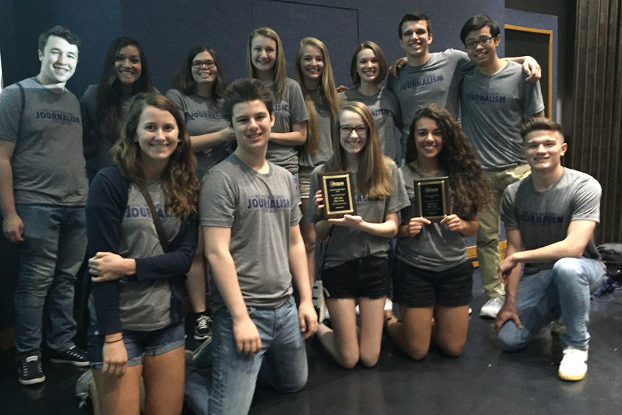 A portion of the state journalism team accepts the school's All-Kansas plaques for the JAG yearbook, JagWire newspaper and MVTV.