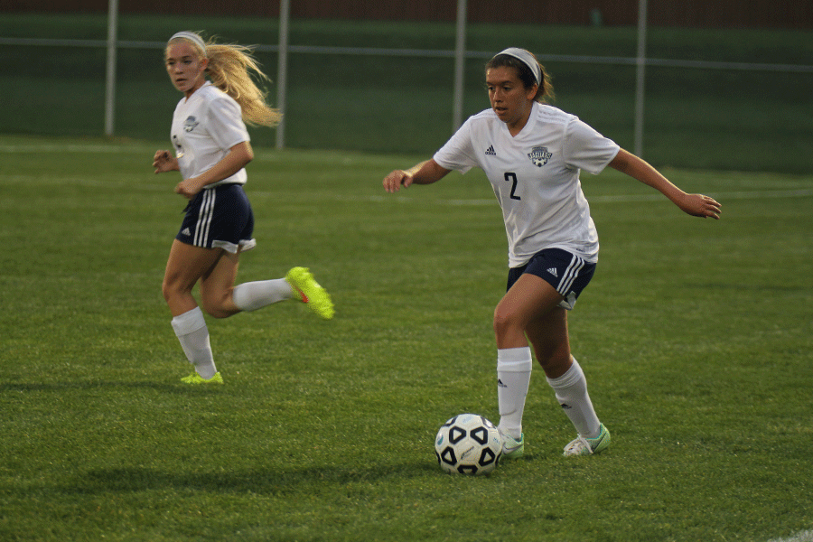 Sophomore Haley Freeman prepares to dribble the ball past defenders.