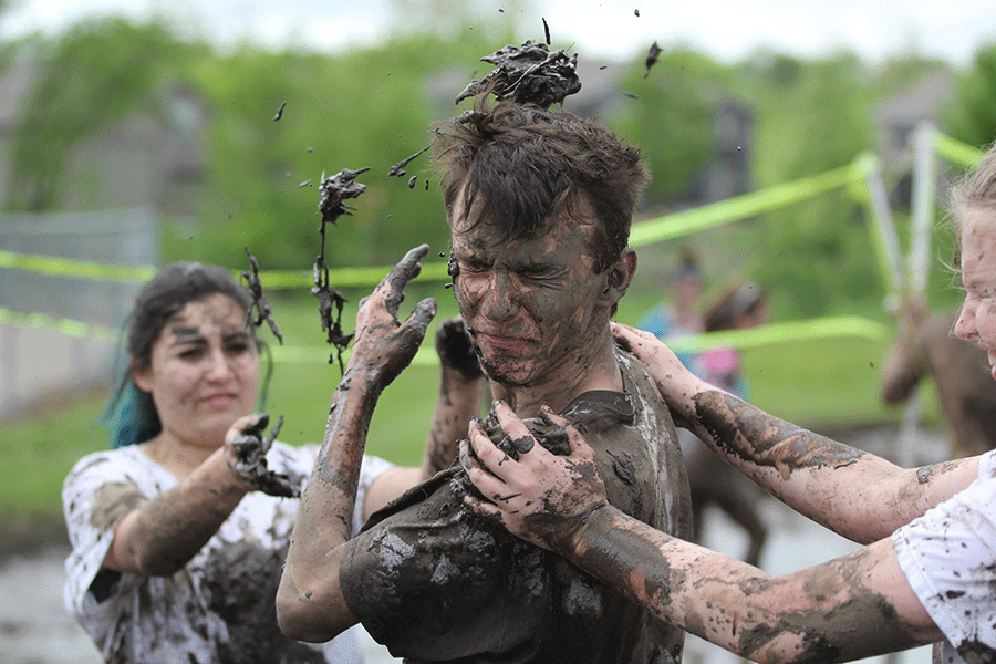 In between games at the Mud Volleyball Tournament on Saturday, May 9, sophomore Landon Smith and friends play in the mud pits created by StuCo members. “I didn’t think it would be fun at first,” Smith said. “but as it progressed, it became a lot of fun for us.” 