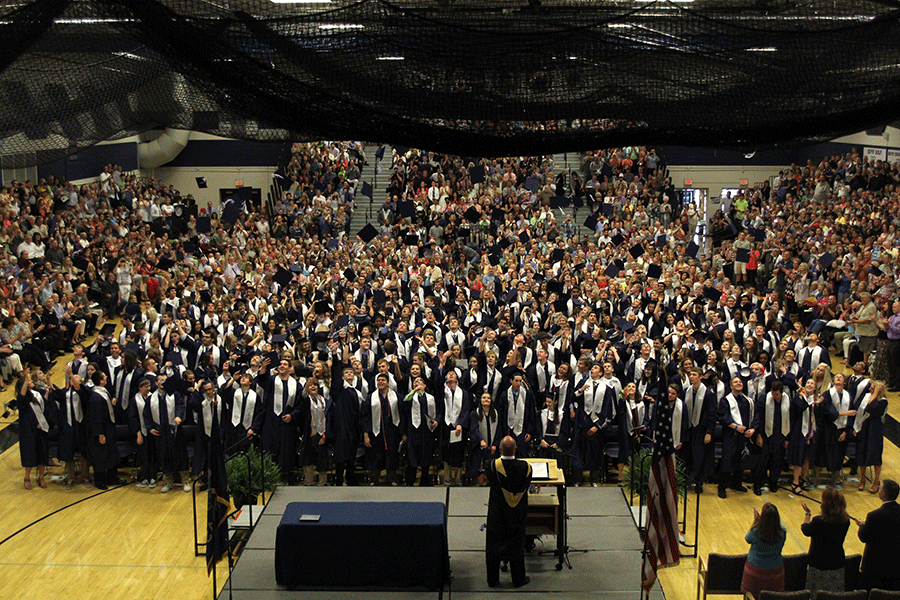 Throwing their hats into the air, the class of 2015 graduates inside the main gymnasium on Saturday, May 16. 