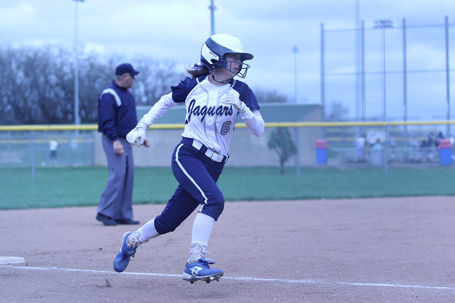 Sophomore+Claire+Anderson+rounds+third+base+in+the+teams+game+against+Basehor-Linwood+on+Thursday%2C+April+9.+