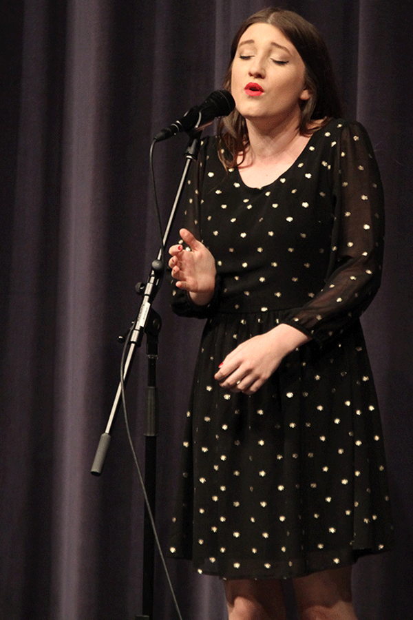 Closing her eyes, senior Brienna Kendall hits a note while performing Gravity by Sara Bareilles with senior Laura Earlenbaugh.