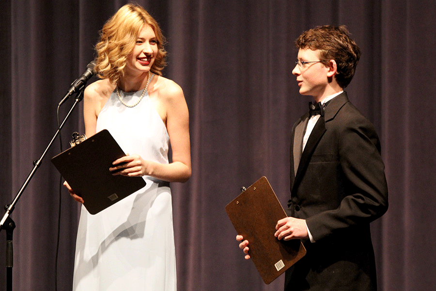 Laughing at junior Allen Weinert, junior Gretchen Gambill co-hosts the senior showcase with Weinert.