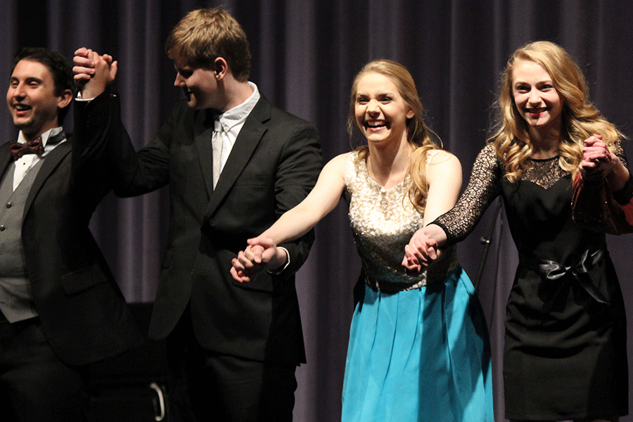 Hand in hand, seniors, including Libby Brennamen, take a bow after their last ever choir performance at Mill Valley.