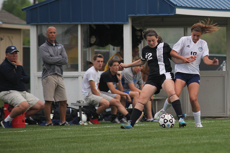 Freshman Emily Munyer taps the ball under another player on Friday, May 1. 