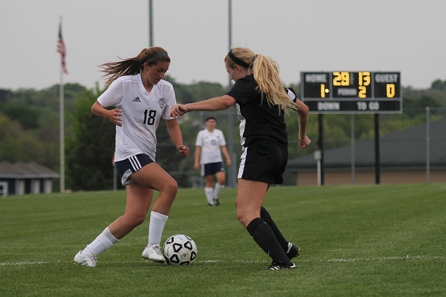 Freshman Emily Munyer taps the ball around another player on Friday, May 1. 