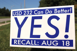 A sign campaigning in favor of Board of Education member Scott Hancocks recall sits outside the entrance to the Crystal Park subdivision at Johnson Drive and Payne Street. Registered voters in the district will vote on whether to recall Hancock from his position on the Board on Tuesday, Aug. 18.