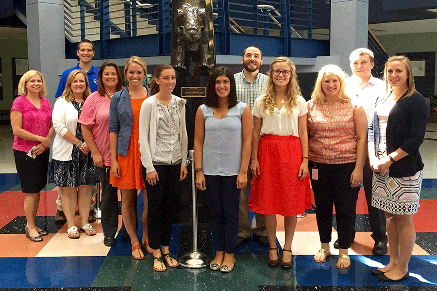 Taking a break from New Teacher Academy, eleven new staff members pose for a photo on Monday, Aug. 10. Not pictured: social studies teacher Chris McAfee.