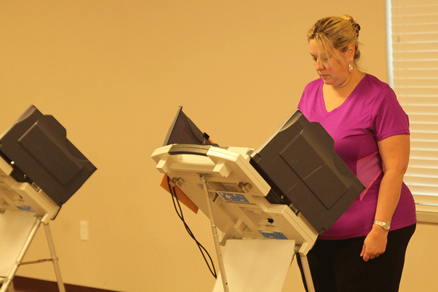District resident Michelle Gaines-Hall votes in the recall election for Board of Education member Scott Hancock at Chapel Oaks Seventh-day Adventist Church on Tuesday, Aug. 18.