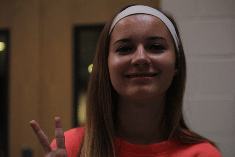Junior Sophia Rosen throws up a gang sign on Tuesday, August 25.