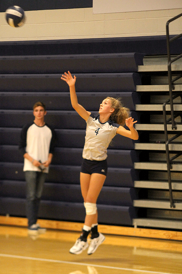 Junior Morgan Thomas serves the volleyball on Friday, Aug. 28.