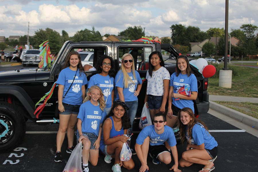 MV Outreach smiles for the camera in front of their homecoming float on Wednesday, Sept. 16.