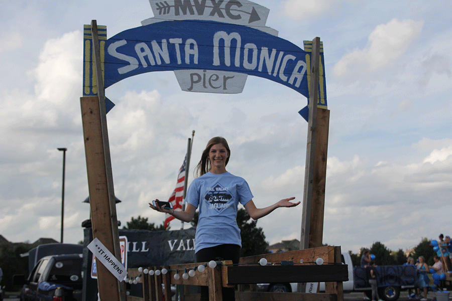 Sophomore Britton Nelson poses on the girls cross country float on Wednesday, Sept. 16.