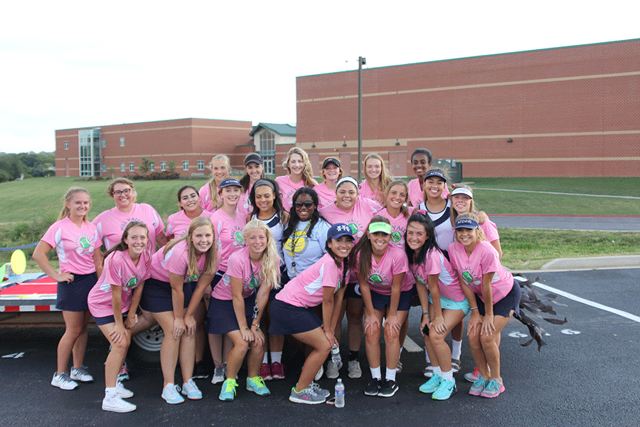 The girls tennis team smiles for the picture on Wednesday, Sept. 16.
