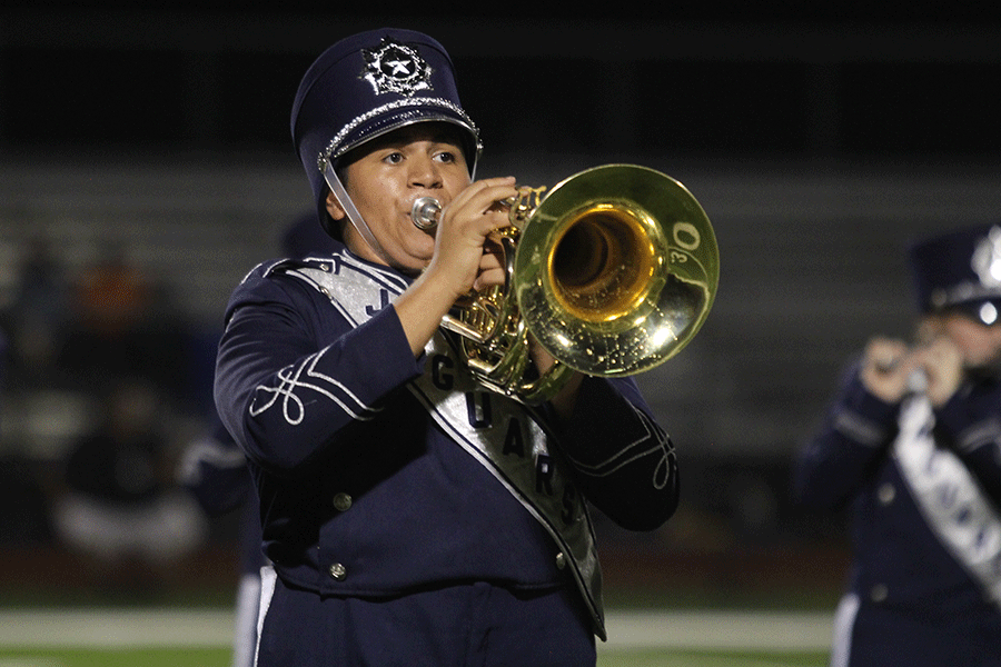 Senior Thomas Franco plays the mellophone during the bands halftime performance.