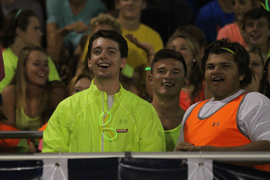 Junior Ross Acree spectates the football game against KC Southwest.