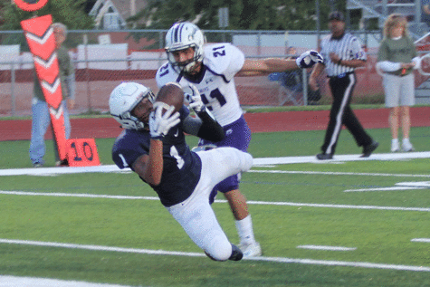 Extending the lead, senior Christian Jegen dives into the Jaguar end zone.