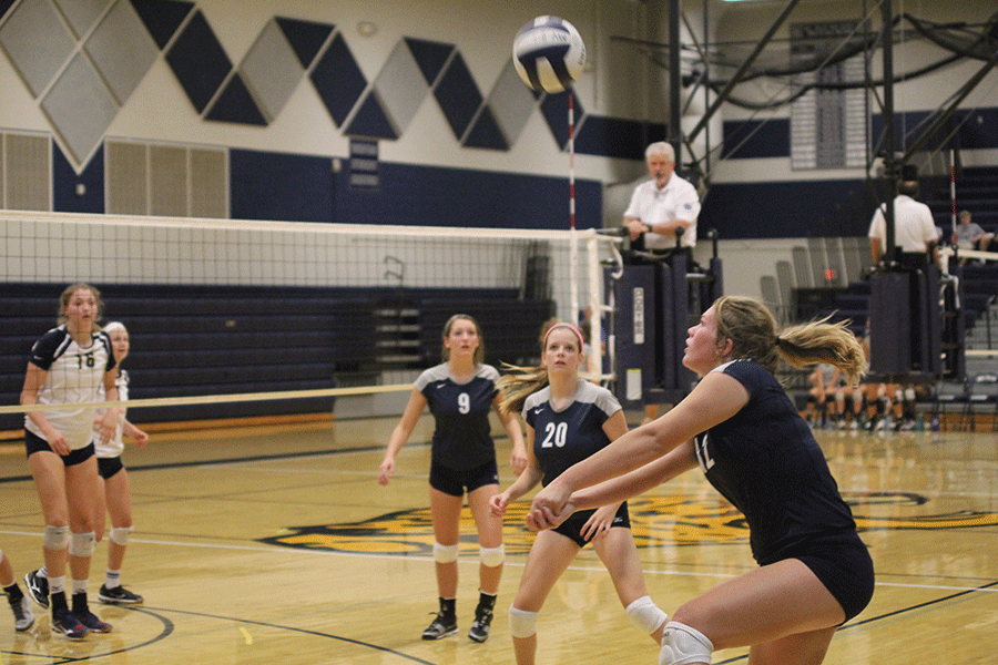 During the match against St. Thomas Aquinas, senior Catie Kaifes passes the ball to her teammate on Tuesday, Sept. 1. “We practiced two and half hours a day to prepare. We had a lot of team bonding to improve our chemistry,” Kaifes said. “I’m very excited for the rest of the season because we have a lot to improve.” 