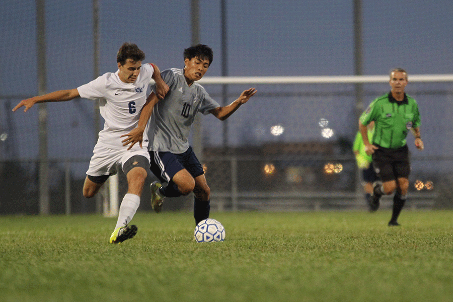 During the boys soccer game on Thursday, Sept. 17, senior Colby Sirivongxay fights for possession of the ball. The team lost 4-3 to Gardner-Edgerton.