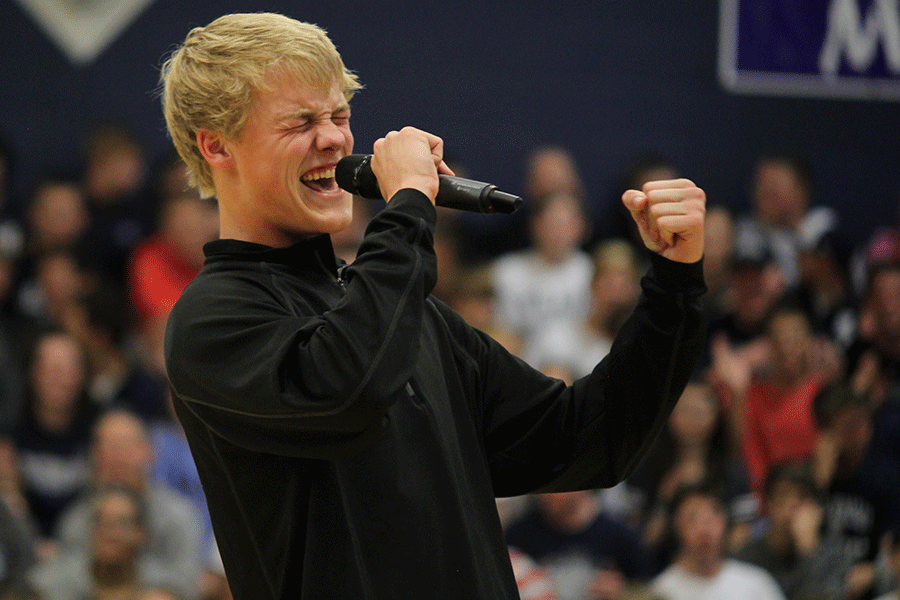 During the candidate game, Homecoming candidate Noah Callahan sings a song from High School Musical into the mic. The Homecoming pep assembly recognized spring sports and Homecoming king and queen candidates while also promoting school spirit.