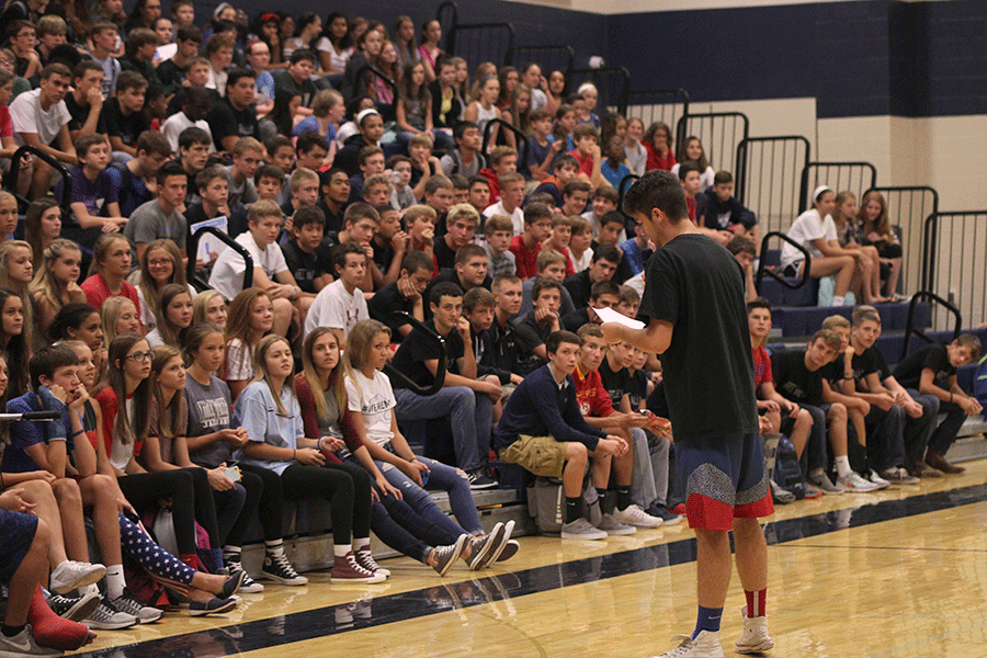 Speaking in front of the freshmen class during seminar on Friday, Sept. 11, senior Cooper Hutteger explains Class Cup.