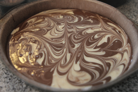 Chocolate and white cake batter swirled together creates marble cake.