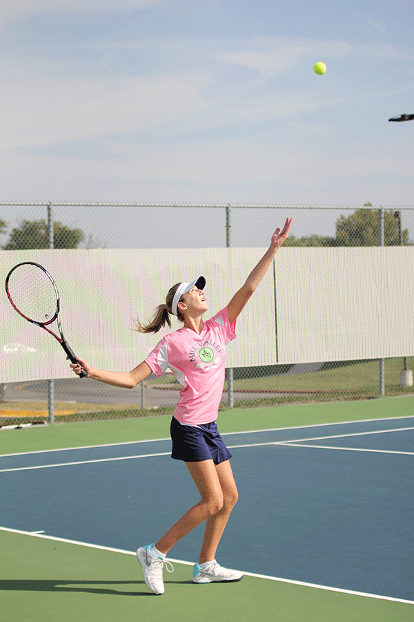 Sophomore Madison VanBuhler serves the ball in a doubles match. 