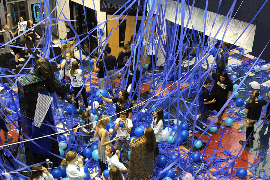 At 6 a.m., seniors continue to decorate the halls for the blue bomb. The seniors began decorating the school at 5:30 a.m. as part of the annual Homecoming tradition.