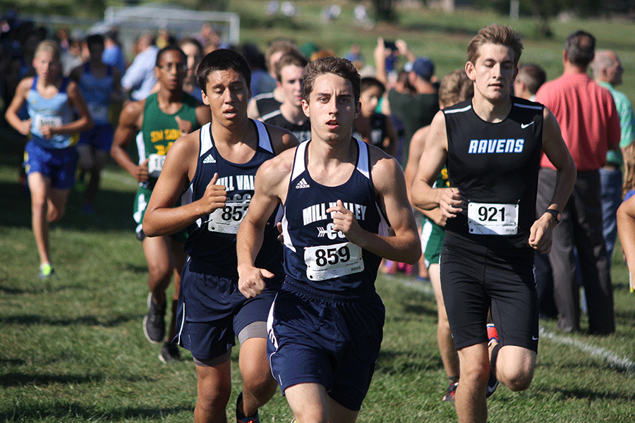 With a determined look on his face, senior Grant Roach pumps his arms to gain speed in the cross country meet on Thursday, Sept. 3 at Johnson County Community College. The boys team placed second after a tie breaker, and the girls team placed first.