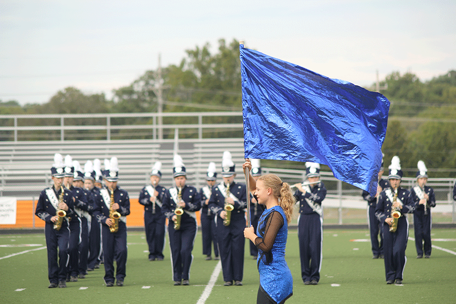 Junior Color Guard Victoria Wesp performs on Thursday, Sept. 24. The band earned a two at the Bonner Springs Marching Band Festival