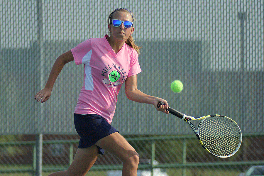 Lunging for the ball, junior Lauren Tracht attempts to volley the ball back towards her Olathe North opponent on Tuesday, Sept. 1.