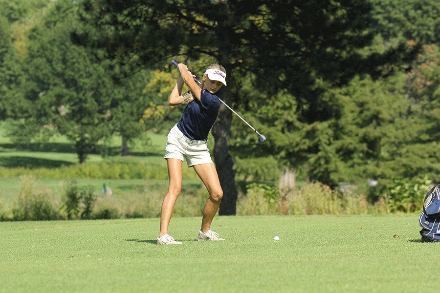 Swinging for the ball, sophomore Bella Hadden contributes to the teams overall score of 130 on Monday, Sept. 28 at Overland Park Golf Course.