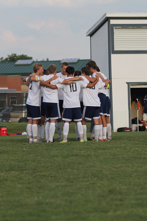 At the beginning of the game the team huddled together.