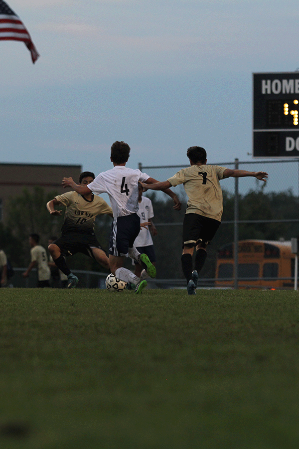 Junior Adam Grube goes in for a tackle to win the ball. 