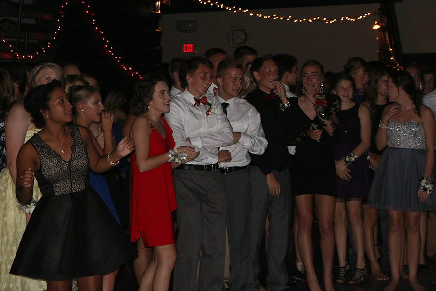 Students watch as their classmates battle it out on the dance floor on Sept. 19.