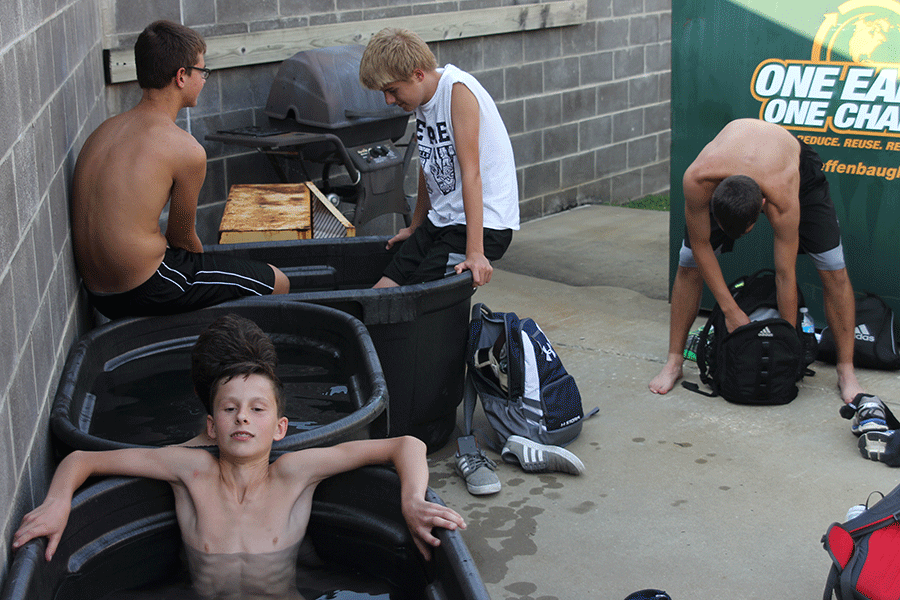 After practice, freshman Ryan Williams takes an ice bath with his teammates on Tuesday, Sept. 1. 