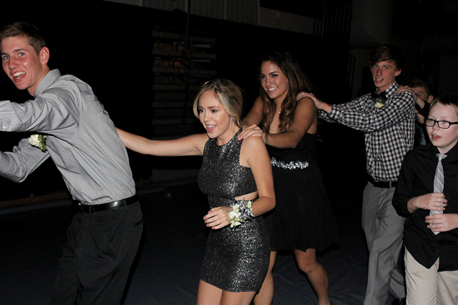 Students participate in a train led by seniors during the Homecoming dance.