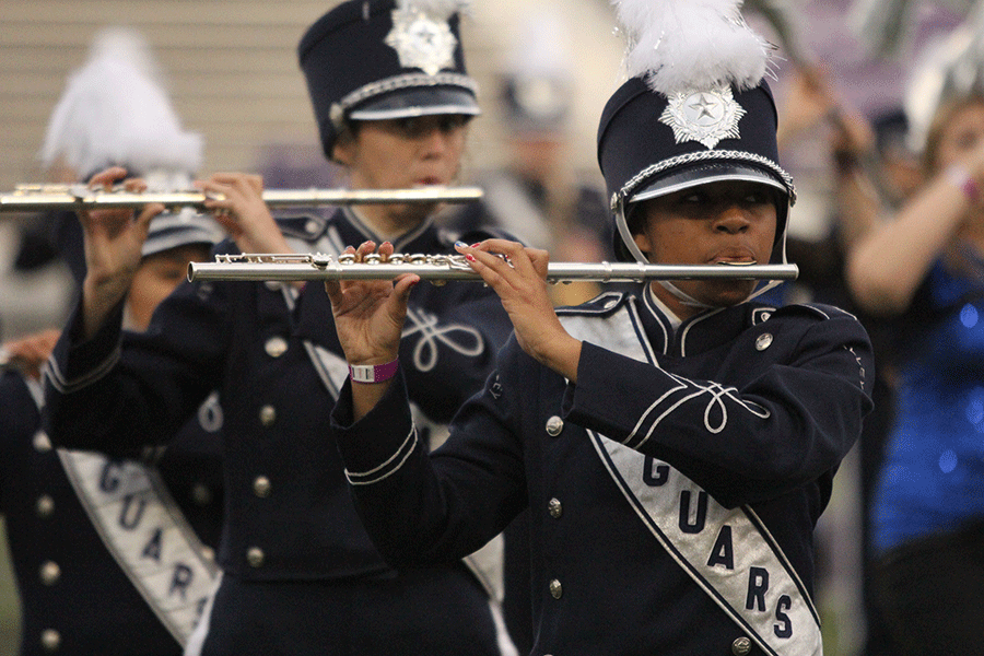 Eyes fixated on the drum majors conducting in front of her, junior Jayna Smith plays the flute at the Central States Marching Festival on Saturday, Oct. 26. My favorite part would have to be performing in the stadium, Smith said. Combining the atmosphere of the band with the size of the college stadium and people in the audience made for an experience Ill never forget. The band received a rating of two for their set.