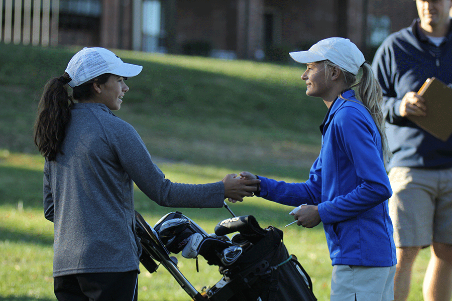 At the start of the regional golf tournament, sophomore Bella Hadden introduces herself to other golfers in her group.