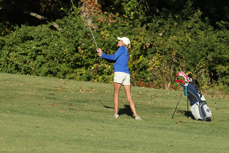 On the first hole at the Shawnee Golf and Country Club, sophomore Bella Hadden chips the ball onto the green.