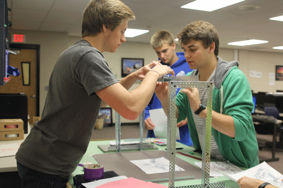Juniors Ben Stadler and Marc Hinnen take a photo of their design for the Battle of the brains on Oct. 16.