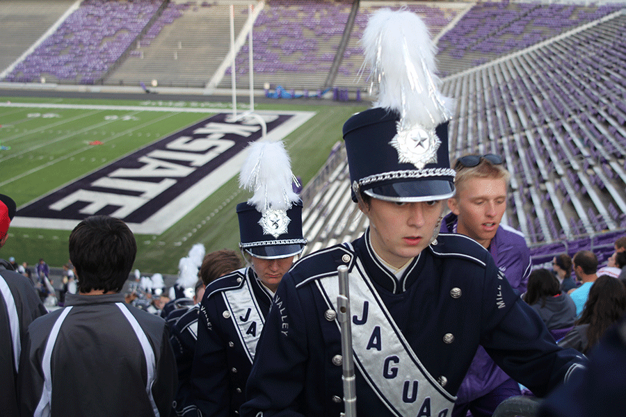 Students exit the stadium after performing their set. 
