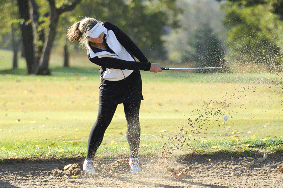 Spraying+up+sand%2C+junior+Meg+Green+hits+her+ball+out+of+a+bunker+at+the+state+tournament+on+Monday%2C+Oct.+19.+As+a+team+the+girls+placed+seventh.