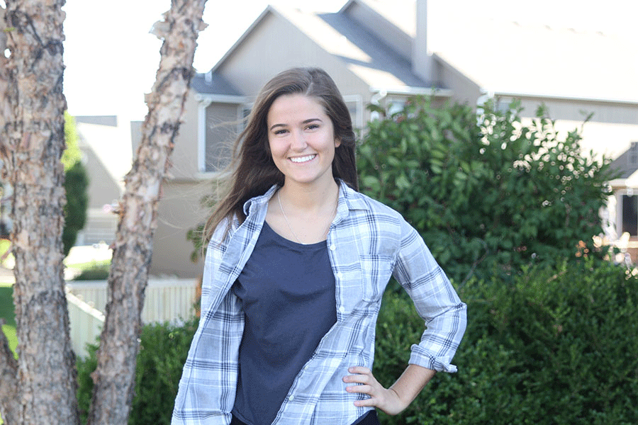 Junior Claire Rachwal poses in her front yard on Monday, Oct. 12. “[I’ve learned] to not take stuff for granted, Rachwal said.