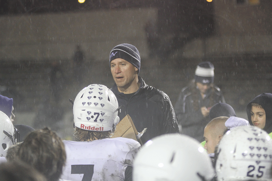 Coach Joel Applebee talks to the team after the game. 