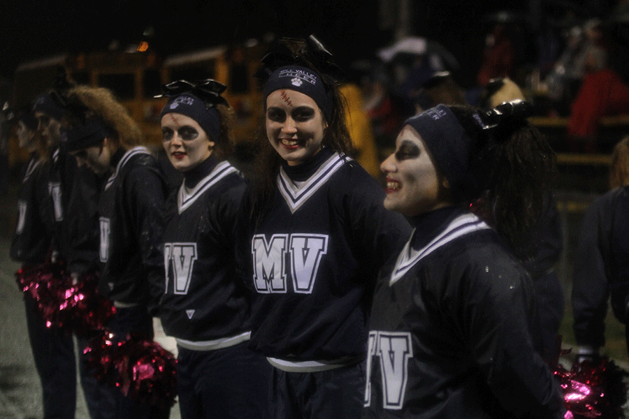 Junior Haley Pultz and Sophomore Brooke Davis talk on the sideline. 