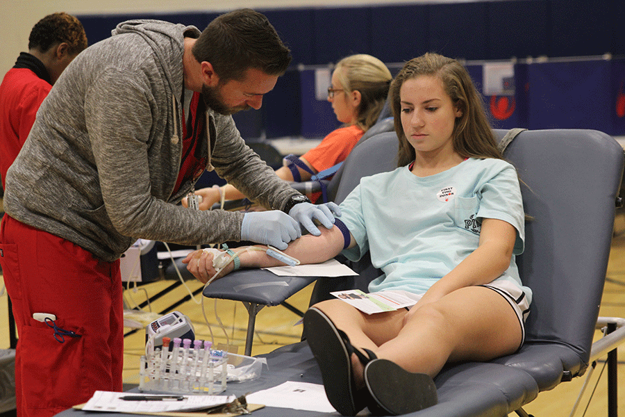 During the blood drive on Thursday, Oct. 22, sophomore Haley Harvey is excited to help others through blood donation. I read this story about this little girl, thanking the people that donated blood, Harvey said. It made me realize that my blood is actually going to help someone. I feel good about it.